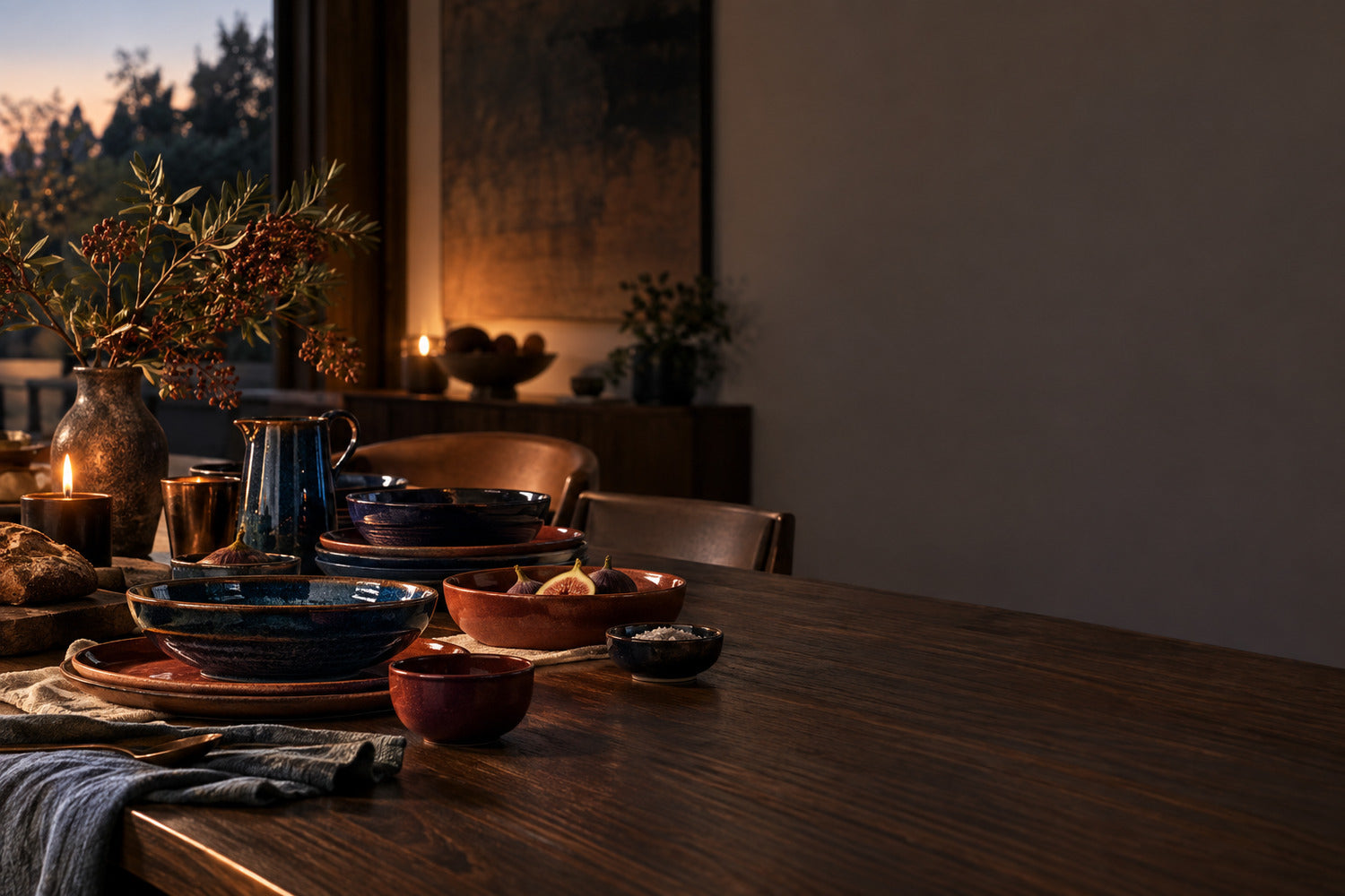 Dusk and Gathering ceramics on a walnut table